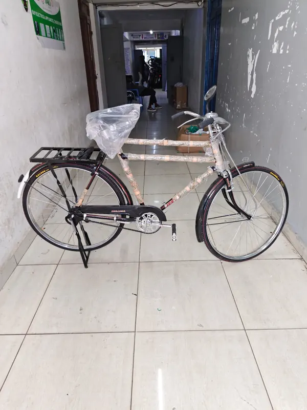 Neelam 28-inch bicycle on its stand, frame still in its protective wrap